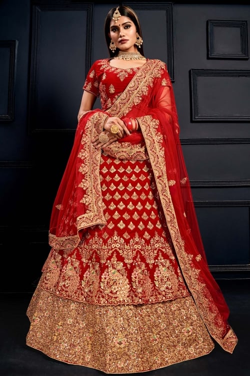 Red Velvet Heavy Embroidered Layered Bridal Lehenga Choli with Peacock Motif