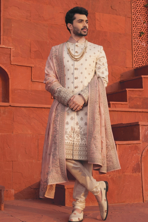 Cream Sherwani with Embroidered Border and Buttis in Silk